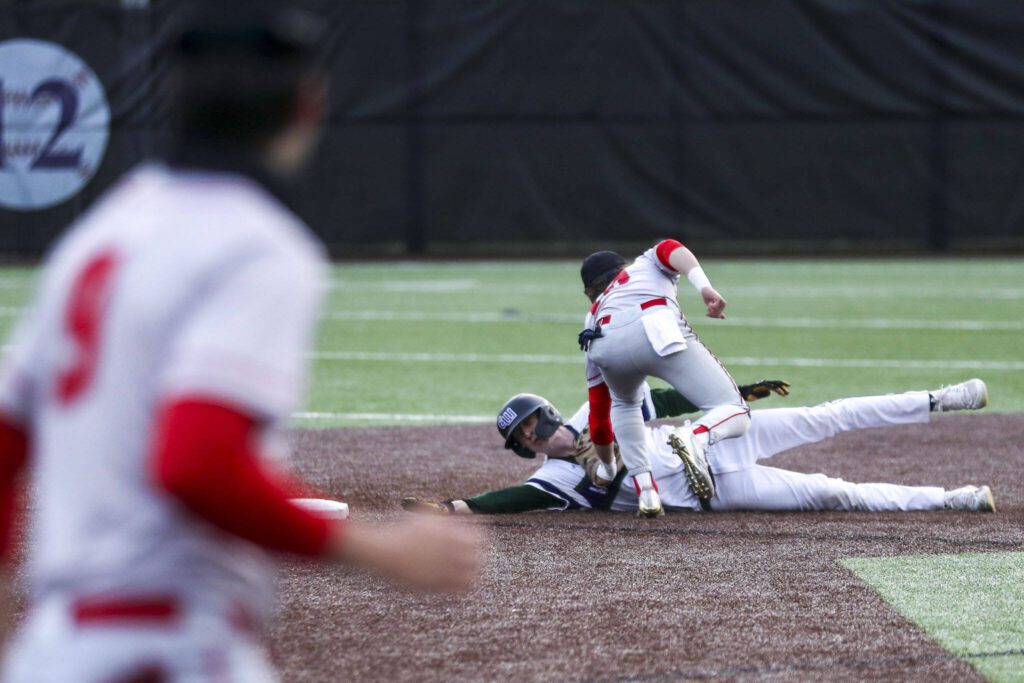 Mountlake Terrace’s Talan Zenk (10) tags a player out during a baseball game between Edmonds-Woodway and Mountlake Terrace at Edmonds-Woodway High School in Edmonds, Washington on Thursday, April 13, 2023. The Warriors won, 5-1. (Annie Barker / The Herald)

