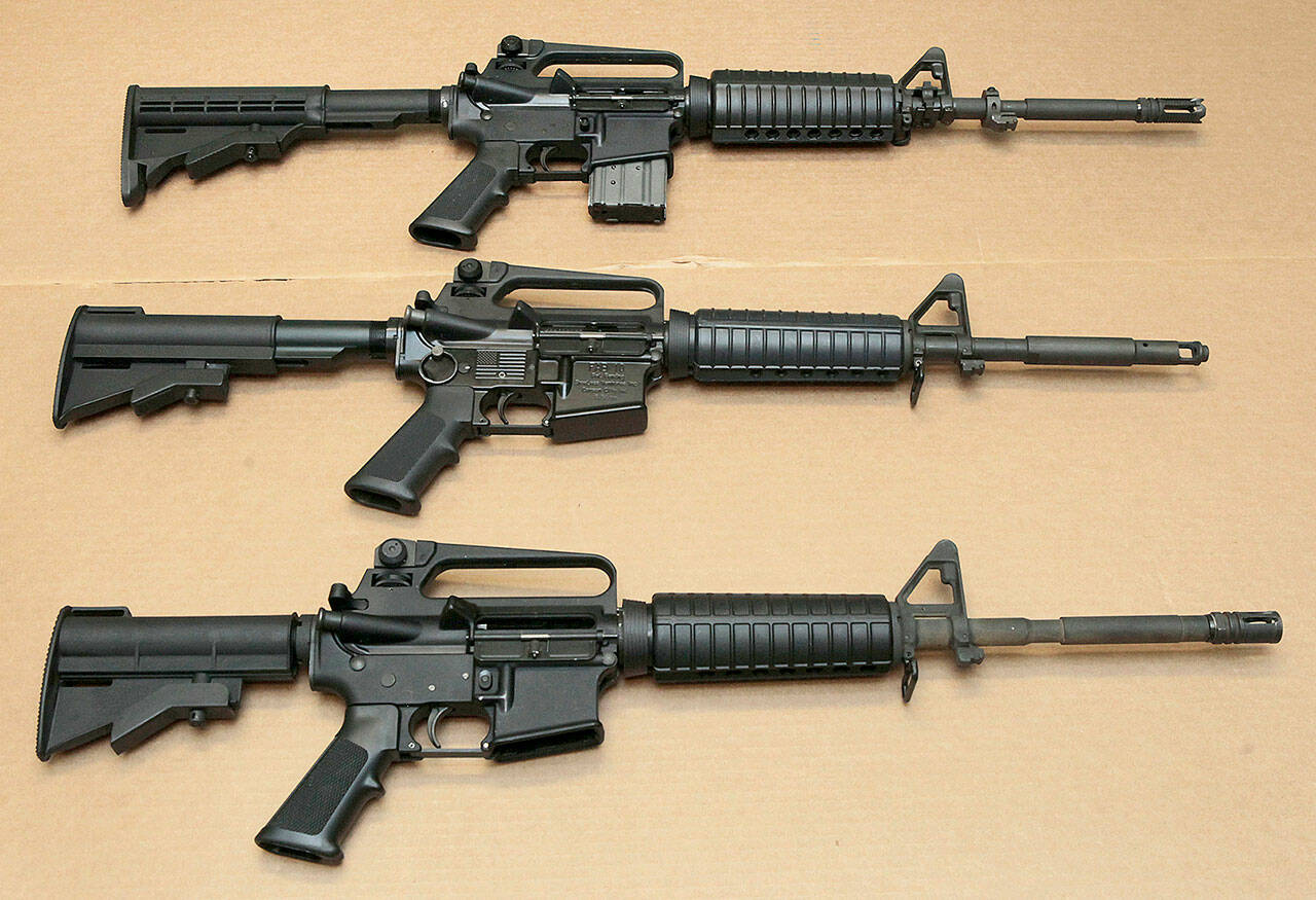 Three variations of the AR-15 assault rifle are displayed on Aug. 15, 2012 at the California Department of Justice in Sacramento, Calif. (AP Photo/Rich Pedroncelli,file)