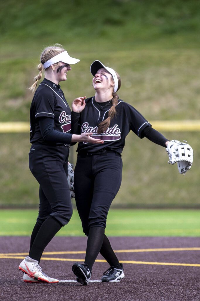 Cascade players celebrate during an Everett and Cascade softball game at Phil Johnson Ballfields in Everett, Washington on Friday, April 21, 2023. Cascade won, 12-2. (Annie Barker / The Herald)
