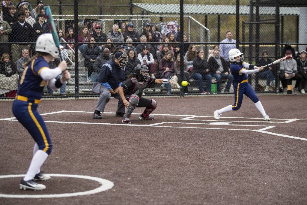 Everett’s Charlie Oyler (14) swings during an Everett and Cascade softball game at Phil Johnson Ballfields in Everett, Washington on Friday, April 21, 2023. Cascade won, 12-2. (Annie Barker / The Herald)
