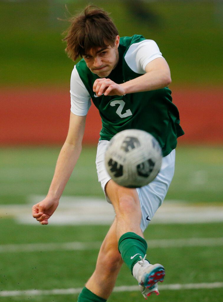 Edmonds-Woodway’s Alexander Bryan boots one up the field against Shorewood on Friday, April 21, 2023, at Edmonds Stadium in Edmonds, Washington. (Ryan Berry / The Herald)
