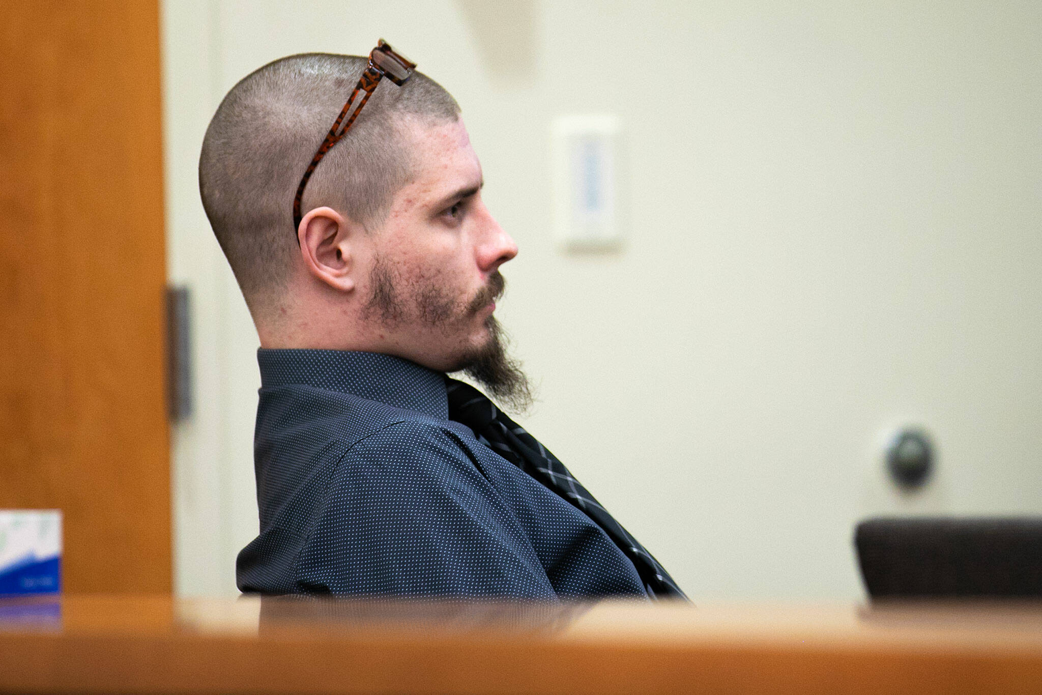 Shayne Baker, charged with multiple 2022 homicides, sits in court during the first day of his trial on Monday, April 24, 2023, at Snohomish County Superior Court in Everett, Washington. (Ryan Berry / The Herald)