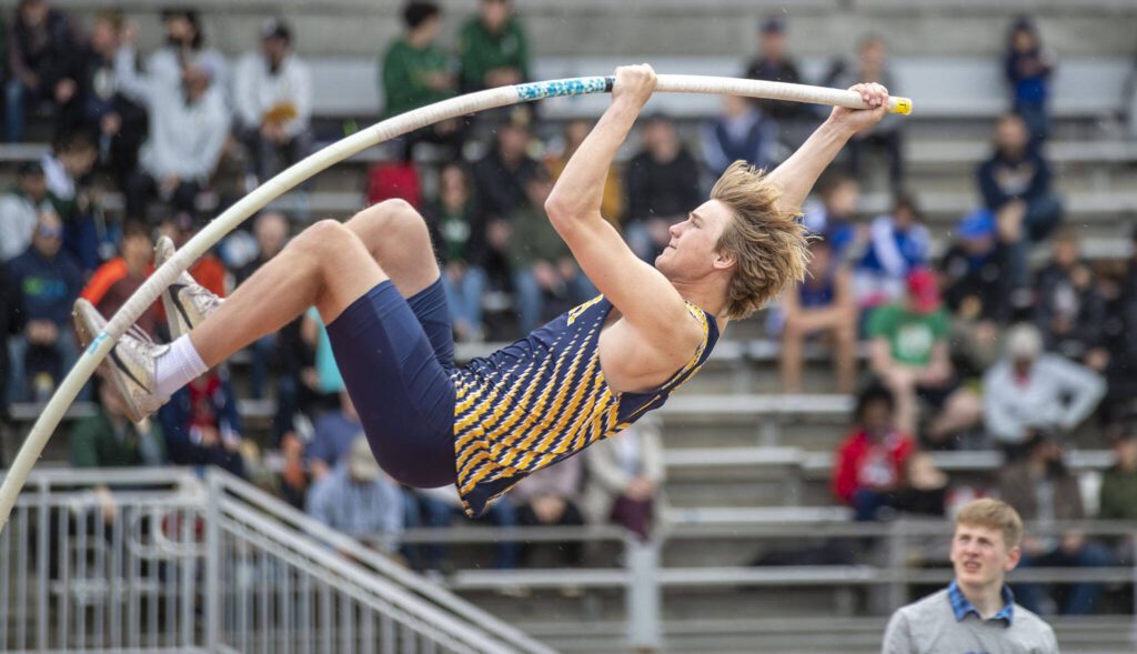 An athlete performs the pole vault during the Eason Invitational at Veterans Memorial Stadium in Snohomish, Washington on Saturday, April 22, 2023. (Annie Barker / The Herald)
