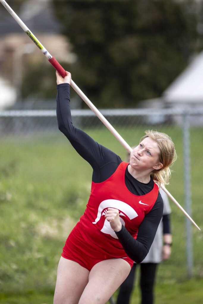 Stanwood’s Grace Crain throws a javelin during the Eason Invitational at Veterans Memorial Stadium in Snohomish, Washington on Saturday, April 22, 2023. (Annie Barker / The Herald)
