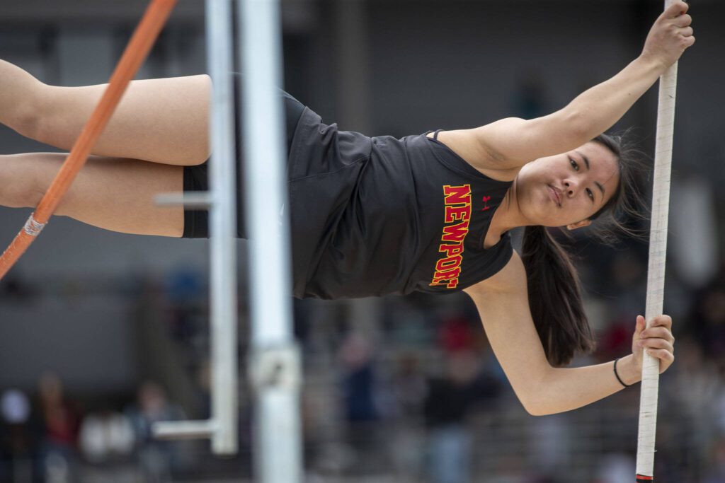 A Newport athlete performs the pole vault during the Eason Invitational at Veterans Memorial Stadium in Snohomish, Washington on Saturday, April 22, 2023. (Annie Barker / The Herald)
