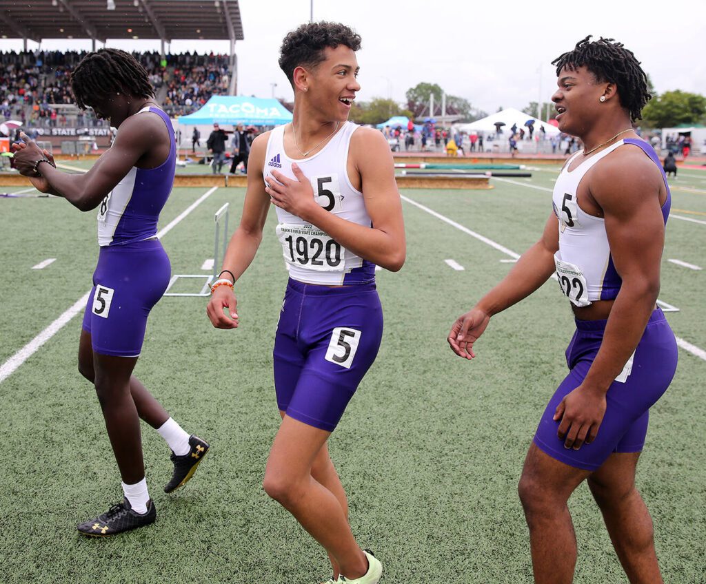 Lake Stevens’ Grant Buckmiller (center) celebrates with his 4×100-meter relay teammates after winning the Class 4A state title in the event on May 28, 2022, at the state track and field championships at Mount Tahoma High School in Tacoma. (Ryan Berry / The Herald)
