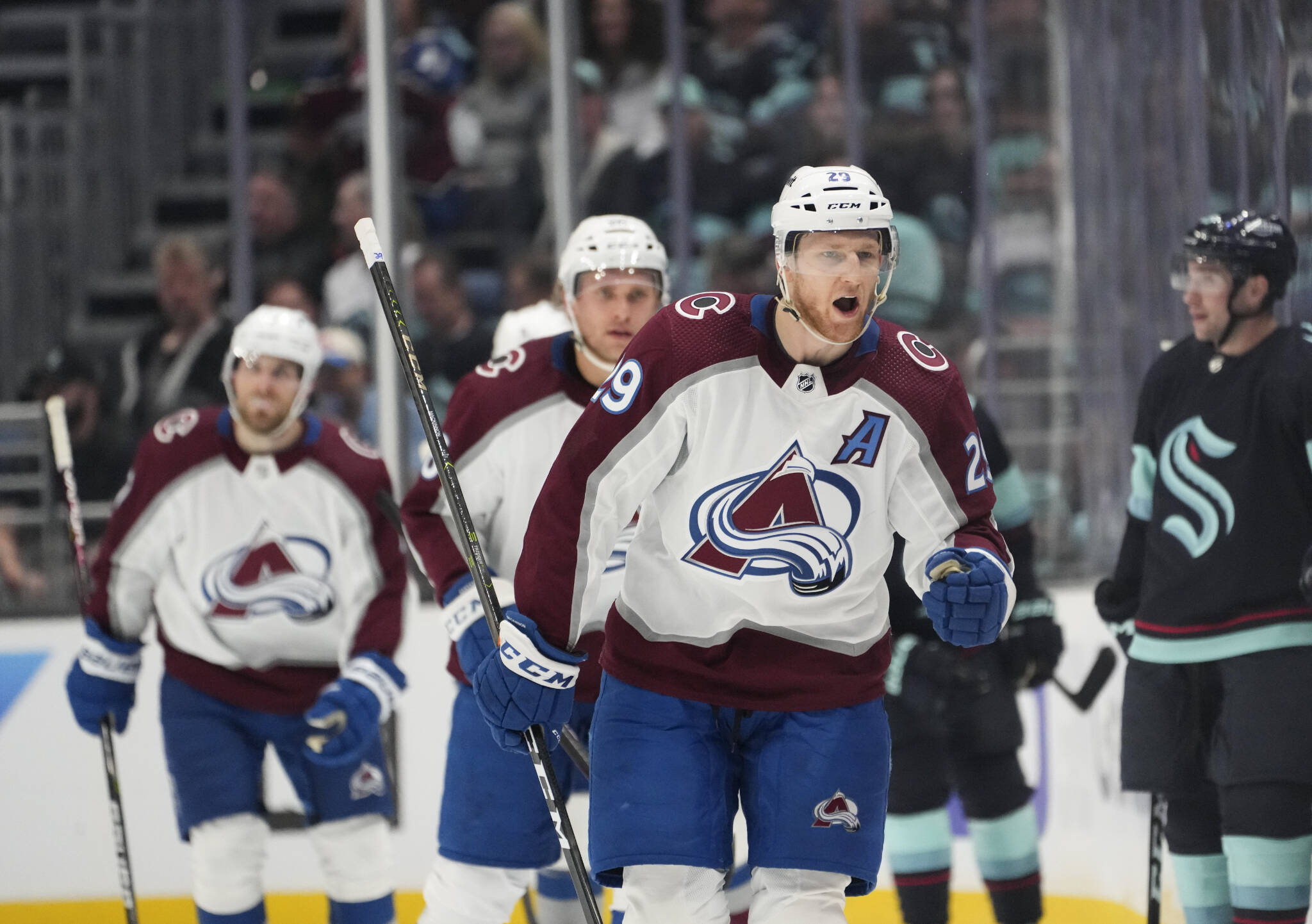 Colorado Avalanche center Nathan MacKinnon (29) reacts after scoring against the Seattle Kraken during Game 3 of a first-round playoff series Saturday in Seattle. (AP Photo/Lindsey Wasson)
