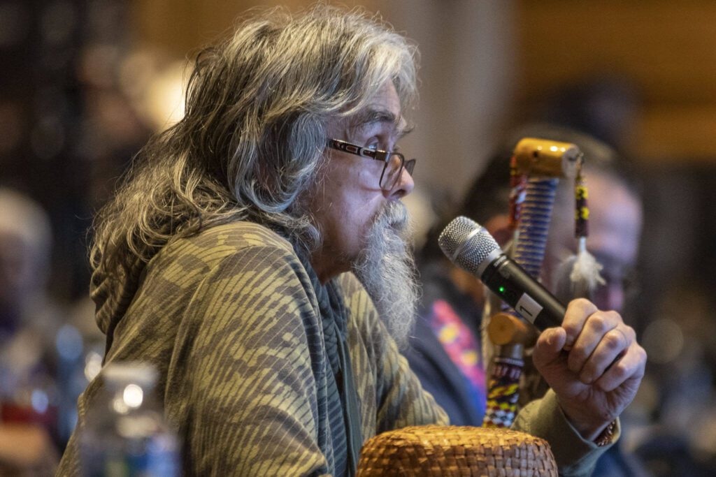 Boarding school survivor Richard Muir Jr., Two Dogs, speaks about his experience during a Road to Healing event at the Tulalip Gathering Hall in Marysville, Washington on Sunday, April 23, 2023. The tour is lead by United States Secretary of the Interior Deb Haaland and Department of the Interior Assistant Secretary Bryan Newland. (Annie Barker / The Herald)
