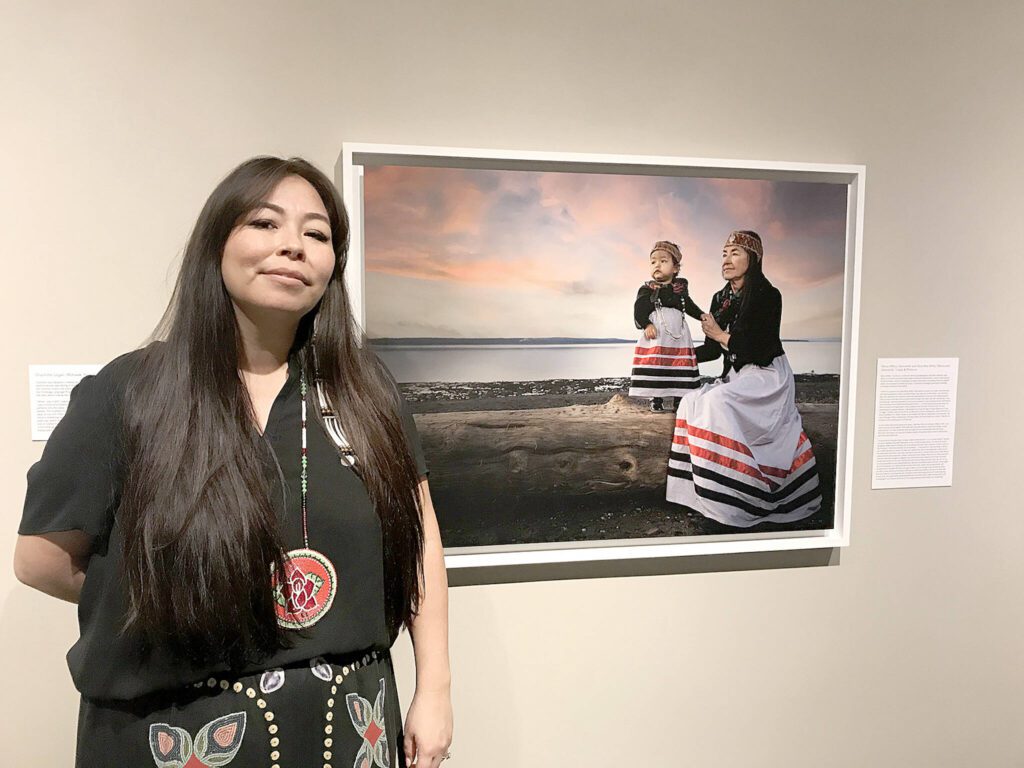Photographer Matika Wilbur from the Tulalip and Swinomish tribes with a piece from her exhibition “Seeds of Culture: Portraits and Stories of Native Women” which was displayed at the Whatcom Museum in Bellingham, Washington. (Gale Fiege / The Herald file)
