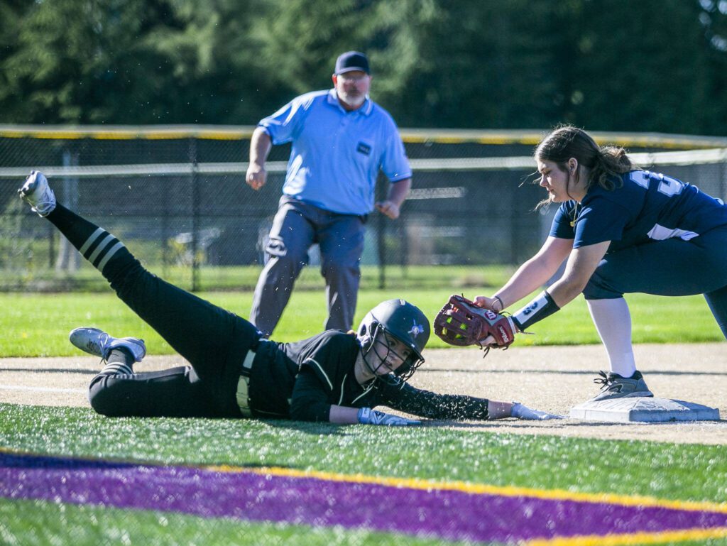 Lake Stevens’ Alexis Johnson slides past third and is tagged out during the game against Glacier Peak on Tuesday, April 25, 2023 in Lake Stevens, Washington. (Olivia Vanni / The Herald)
