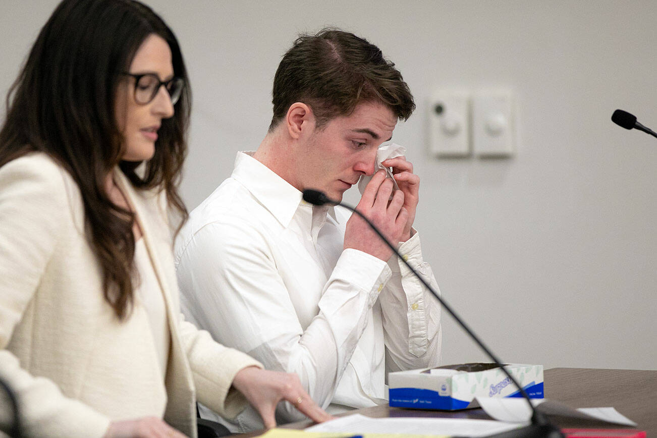 Matias Trefault, who killed Reynold Joel in a 2019 car wreck, wipes away tears after being given forgiveness from Joel’s wife during his sentencing hearing Thursday, April 27, 2023, at Snohomish County Superior Court in Everett Washington. (Ryan Berry / The Herald)
