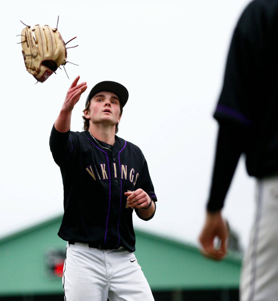 Lake Stevens’ Wyatt Queen tosses his mitt after recording the final out in a win over Jackson on Wednesday, April 26, 2023, in Lake Stevens, Washington. (Ryan Berry / The Herald)
