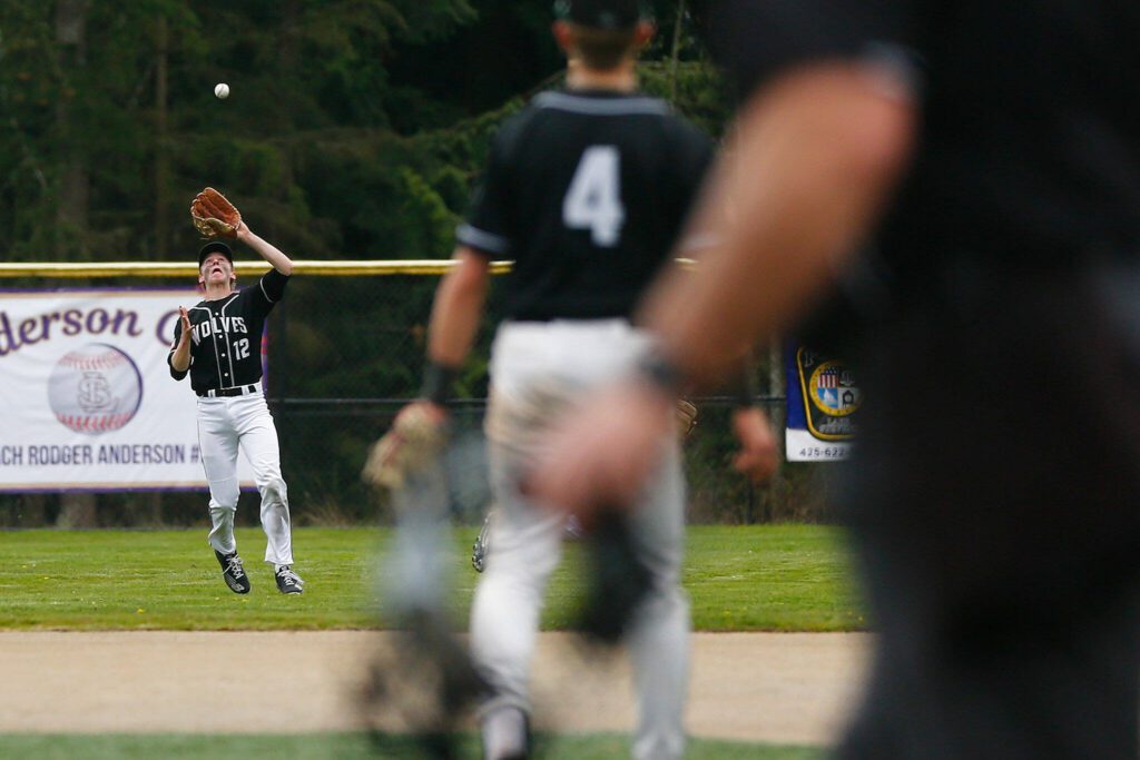 Jackson’s Matt Dickert catches a pop fly to center against Lake Stevens on Wednesday, April 26, 2023, in Lake Stevens, Washington. (Ryan Berry / The Herald)
