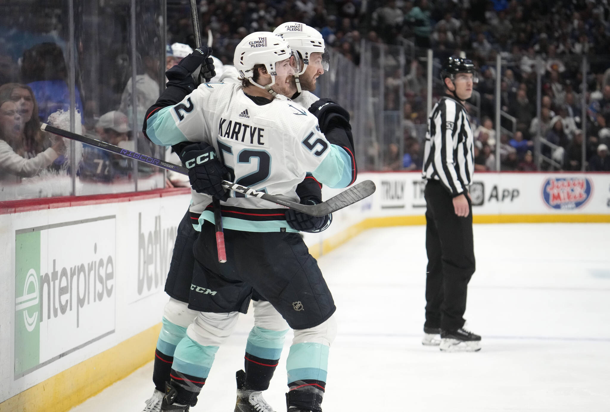 Kraken forward Tye Kartye (front) celebrates his goal with defenseman Will Borgen during the second period of Game 5 of a first-round playoff series against the Avalanche on Wednesday in Denver. (AP Photo/David Zalubowski)