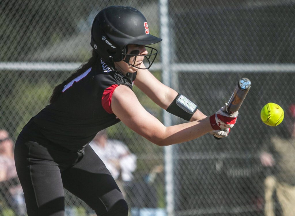 Snohomish&rsquo;s Bridget Johnson bunts the ball during the game against Cascade on Friday, April 28, 2023 in Snohomish, Washington. (Olivia Vanni / The Herald)
