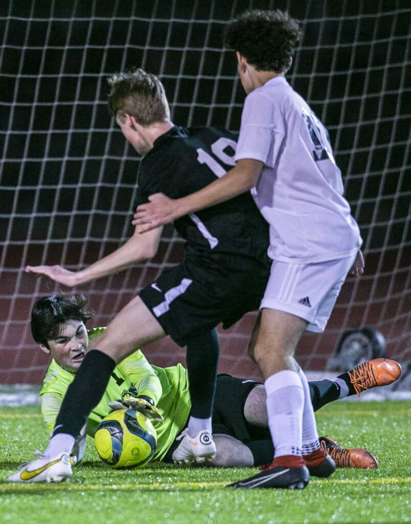 Jackson goalie Ben Ferguson blocks a shot during the game against Glacier Peak on Friday, April 28, 2023 in Snohomish, Washington. (Olivia Vanni / The Herald)
