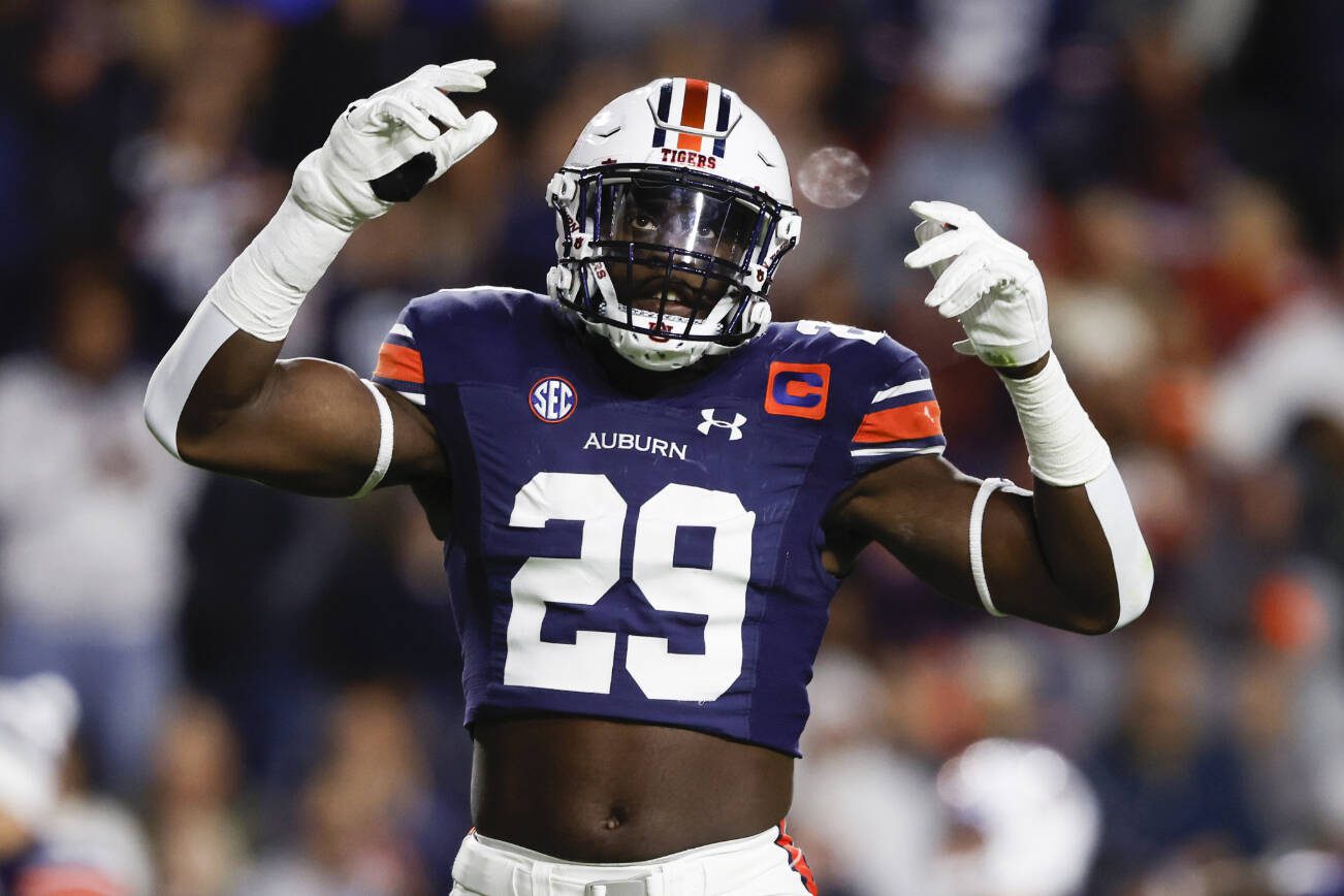 Auburn linebacker Derick Hall reacts after a stop against Texas A&M during the first half of an NCAA college football game Saturday, Nov. 12, 2022, in Auburn, Ala. (AP Photo/Butch Dill)