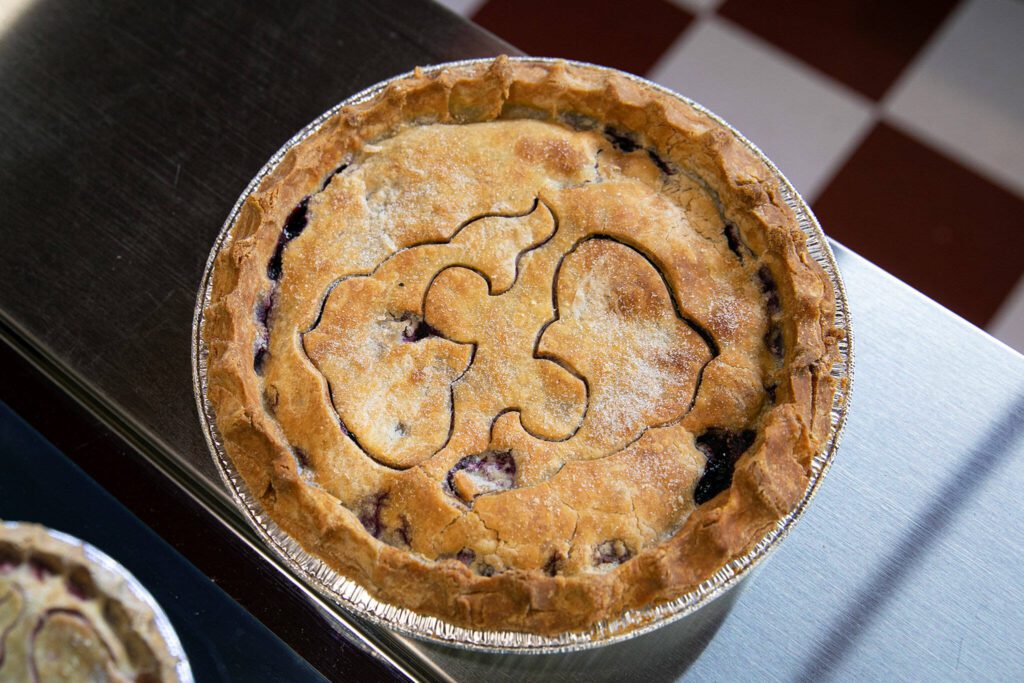 A gluten-free pie features two fish — the symbol for Pisces — at Pisces Pies on Thursday, April 13, 2023, in north Everett, Washington. (Ryan Berry / The Herald)
A gluten-free pie features two fish — the symbol for Pisces — at Pisces Pies on Thursday, April 13, 2023, in north Everett, Washington. (Ryan Berry / The Herald) 
