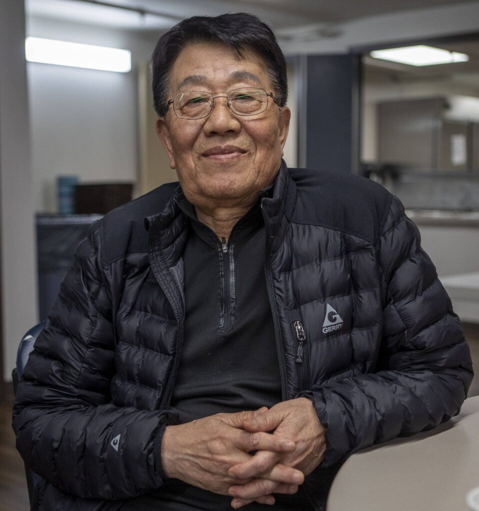 Jae Kim poses for a photo during a senior community meals program focused on the Korean community at Homage in Lynnwood, Washington on Thursday, May 4, 2023. (Annie Barker / The Herald)
