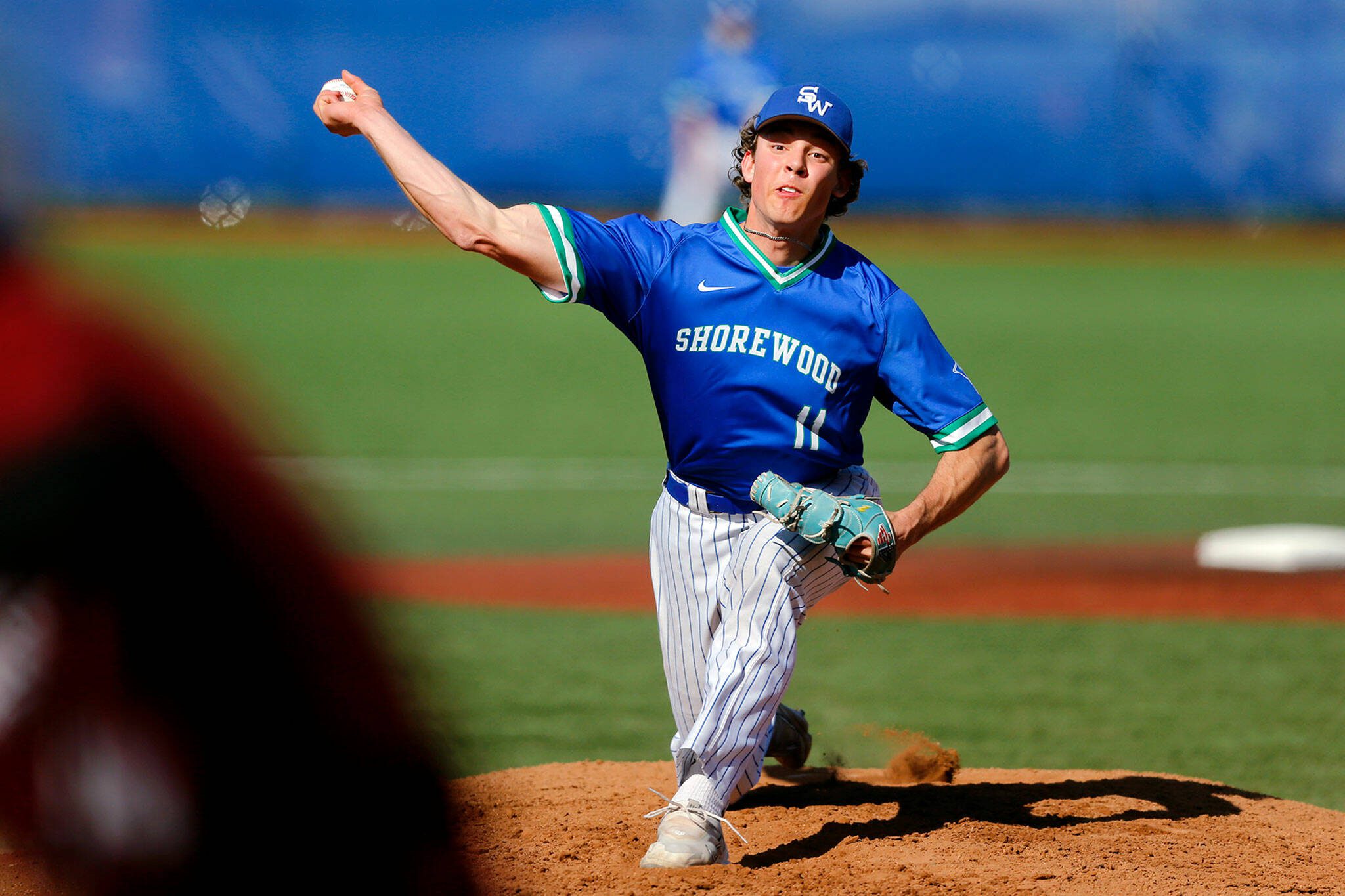 Shorewood starting pitcher Logan Anderson strikes out a batter in a victory over Cedarcrest on Thursday, April 27, 2023, at Meridian Park in Shoreline, Washington. (Ryan Berry / The Herald)