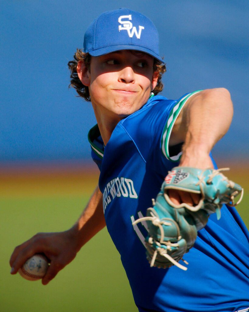 Shorewood pitcher Logan Anderson reaches back during his windup while pitching in a victory over Cedarcrest on Thursday, April 27, 2023, at Meridian Park in Shoreline, Washington. (Ryan Berry / The Herald)
