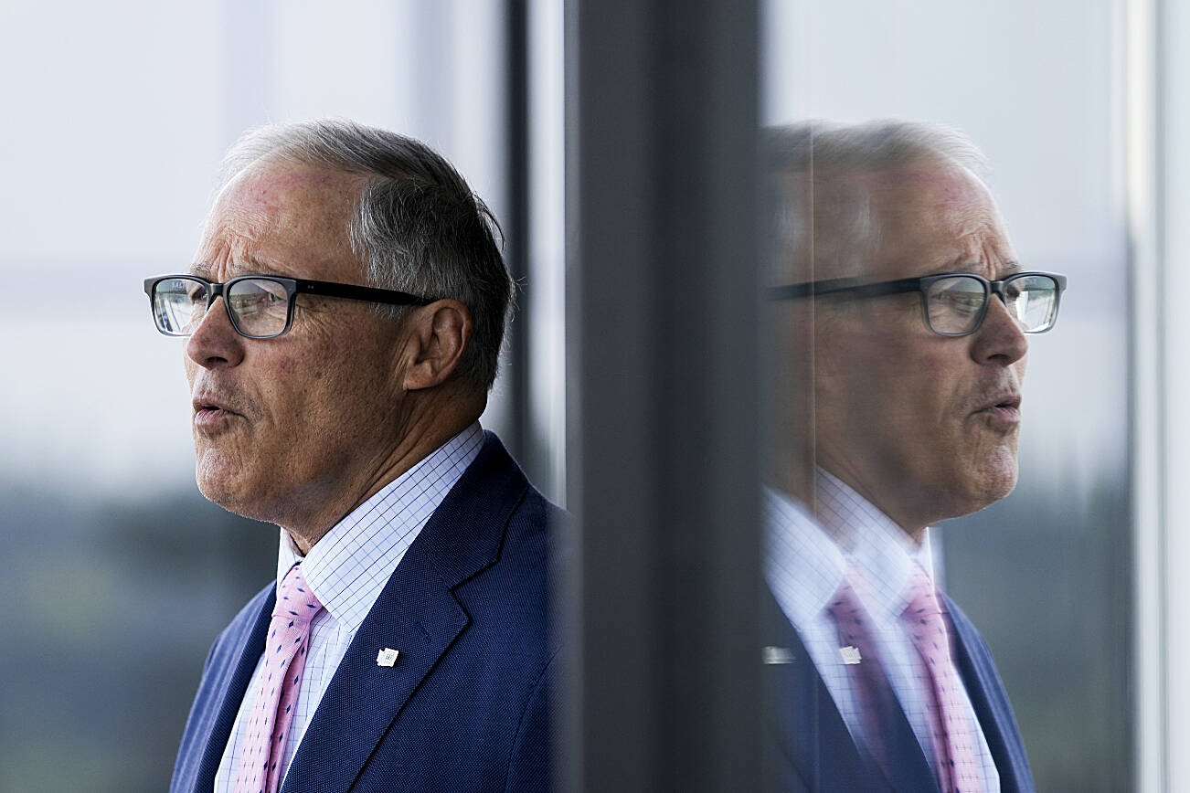 FILE - Washington Gov. Jay Inslee arrives at the University of Washington's Hans Rosling Center for Population Health ahead of signing several bills aimed at protecting reproductive health and gender-affirming care in Washington, Thursday, April 27, 2023, in Seattle. On Monday, May 1, 2023, Inslee announced he does not plan to seek a fourth term. He was most recently re-elected in 2020, making him only the second Washington state governor to serve three consecutive terms. (AP Photo/Lindsey Wasson, File)