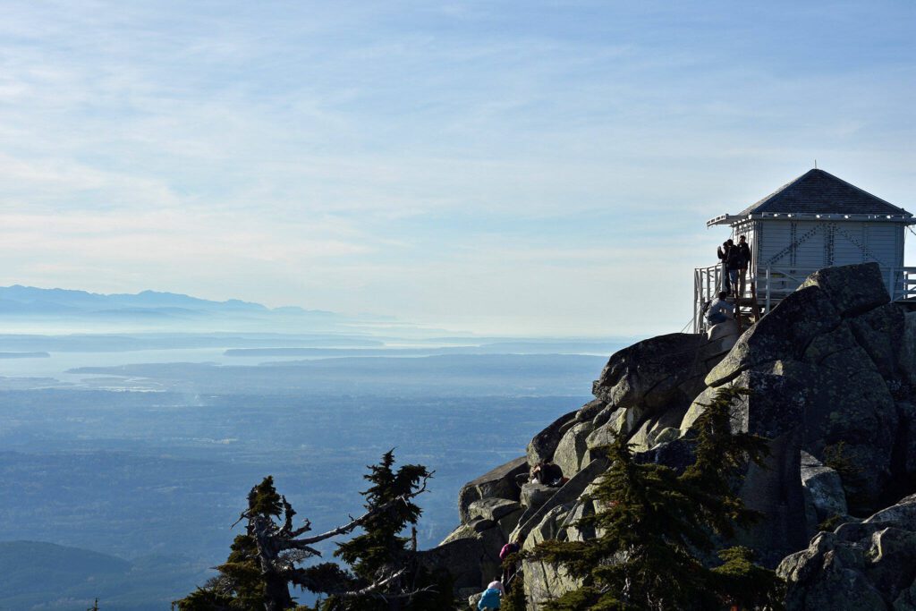 The Mount Pilchuck fire lookout offers sweeping 360-degree views of Puget Sound, the Olympic Mountains and the North Cascades. (Caleb Hutton / The Herald)
