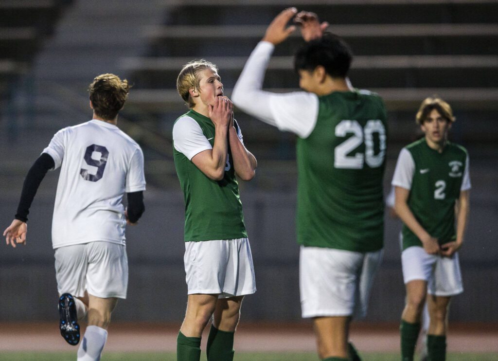 Edmonds-Woodway players react to a goal scored by Everett during the game on Monday, May 1, 2023 in Edmonds, Washington. (Olivia Vanni / The Herald)
