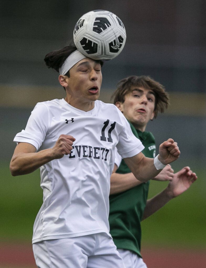 Everett’s J’aiden Cranwell-Meneses heads the ball during the game against Edmonds-Woodway on Monday in Edmonds. (Olivia Vanni / The Herald)

