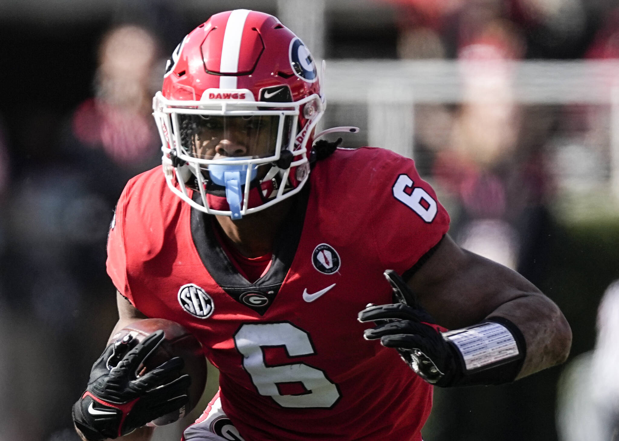 Georgia running back Kenny McIntosh carries the ball during the first half of a game against Georgia Tech on Nov. 26, 2022, in Athens, Ga. (AP Photo/John Bazemore)