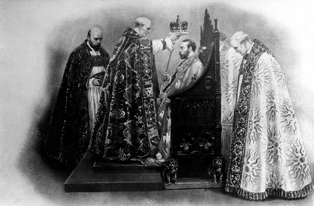 The Archbishop of Canterbury places the crown on King George V during his coronation ceremony at Westminster Abbey in London, England, June 22, 1911. At left is the dean of Westminster, and at right is the Bishop of Bath and Wells. (AP Photo)