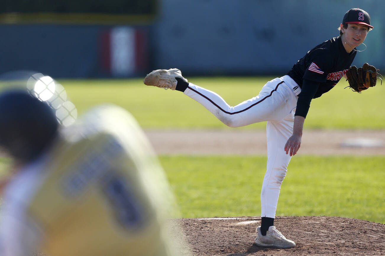Snohomish senior pitcher Van Berman strikes out a batter to and the inning during a matchup against Arlington on Friday, April 14, 2023, at Earl Torgeson Field in Snohomish, Washington. (Ryan Berry / The Herald)