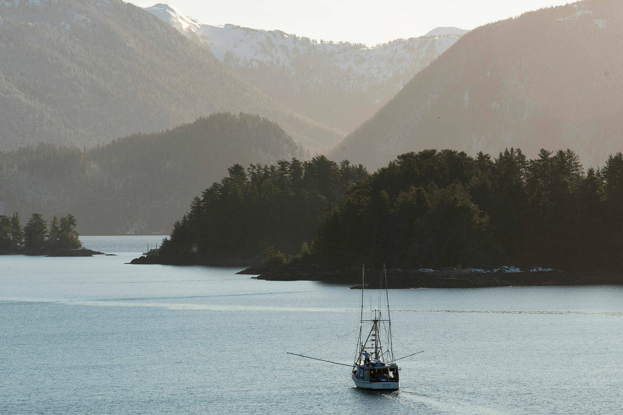 A troller fishes in Sitka Sound, Alaska on February 2, 2021. A ruling from a U.S. judge in Seattle could effectively shut down commercial king salmon trolling in Southeast Alaska — a valuable industry that supports some 1,500 fishermen — after a conservation group challenged the harvest as a threat to protected fish and the endangered killer whales that eat them. (James Poulson/Daily Sitka Sentinel via AP)