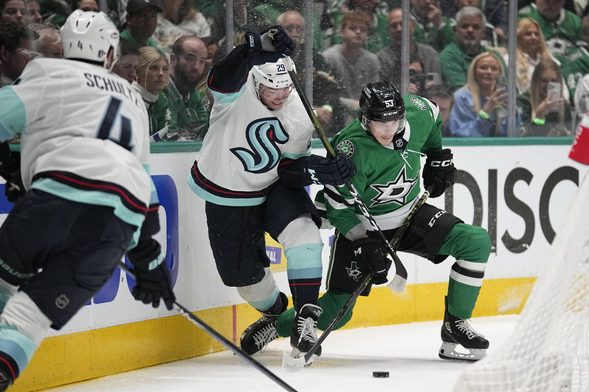 Kraken defenseman Vince Dunn (29) and the Stars’ Wyatt Johnston (53) compete for control of the puck during the first period of Game 2 of a second-round playoff series Thursday in Dallas. (AP Photo/Tony Gutierrez)