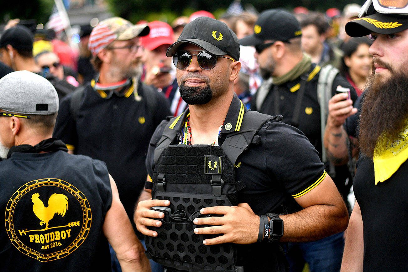FILE - Proud Boys chairman Enrique Tarrio rallies in Portland, Ore., on Aug. 17, 2019. Tarrio and three other members of the far-right extremist group have been convicted of a plot to attack the U.S. Capitol in a desperate bid to keep Donald Trump in power after Trump lost the 2020 presidential election.  (AP Photo/Noah Berger, File)