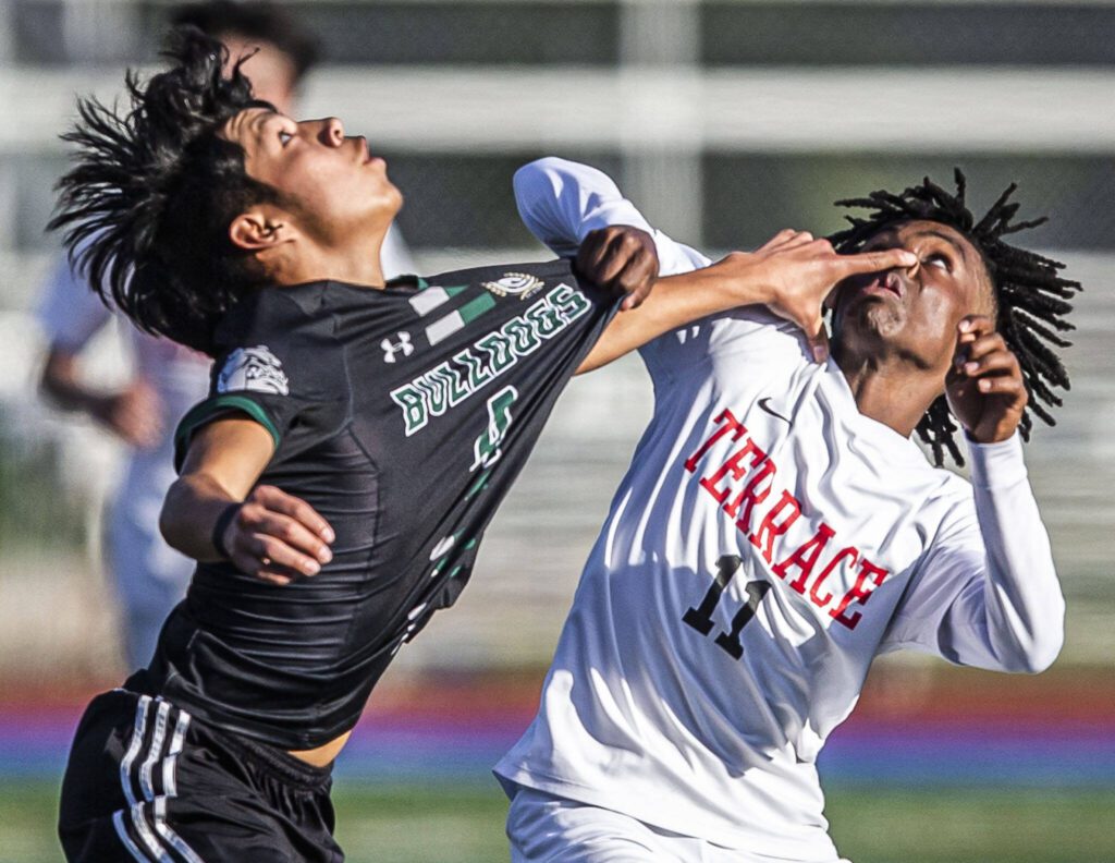 Mountlake Terrace’s Ash Jeffers is poked in the face while trying to head a ball during the game against Mount Vernon on Tuesday, May 9, 2023 in Shoreline, Washington. (Olivia Vanni / The Herald)
