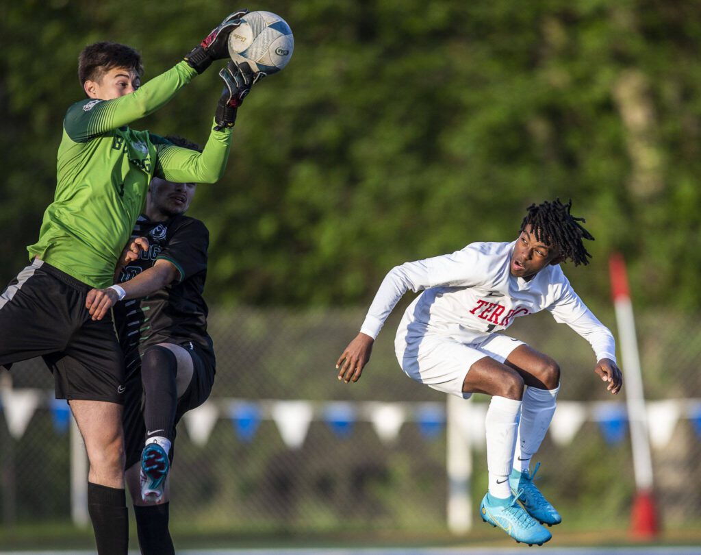 Mountlake Terrace’s Ash Jeffers ducks while jumping for the ball during the game against Mount Vernon on Tuesday, May 9, 2023 in Shoreline, Washington. (Olivia Vanni / The Herald)
