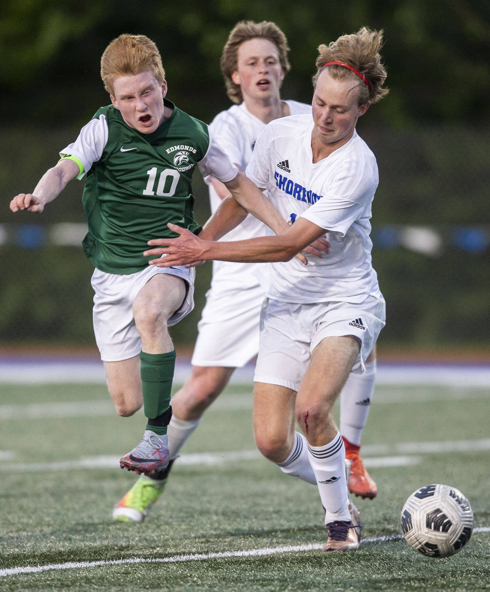 Edmonds-Woodway’s Ben Hanson runs after the ball during the game against Shorewood on Tuesday, May 9, 2023 in Shoreline, Washington. (Olivia Vanni / The Herald)
