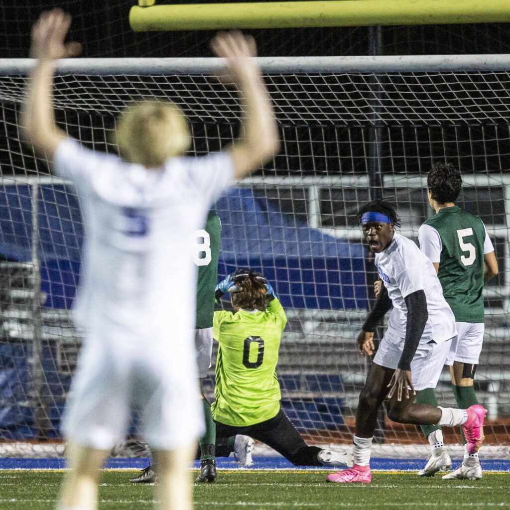 Shorewood’s Anthony Henry and teammates react to a goal that puts them in the lead in the final minutes of the game against Edmonds-Woodway on Tuesday, May 9, 2023 in Shoreline, Washington. (Olivia Vanni / The Herald)
