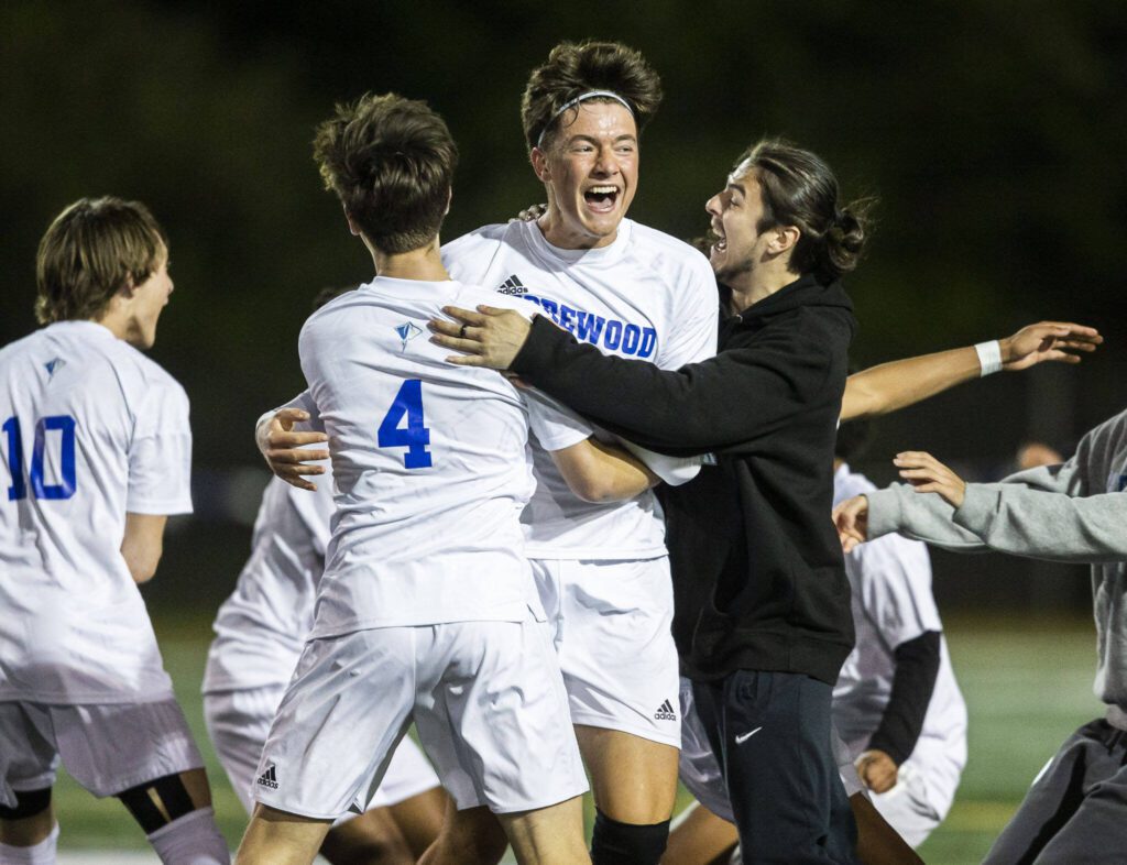 Shorewood players celebrate beating Edmonds-Woodway on Tuesday, May 9, 2023 in Shoreline, Washington. (Olivia Vanni / The Herald)
