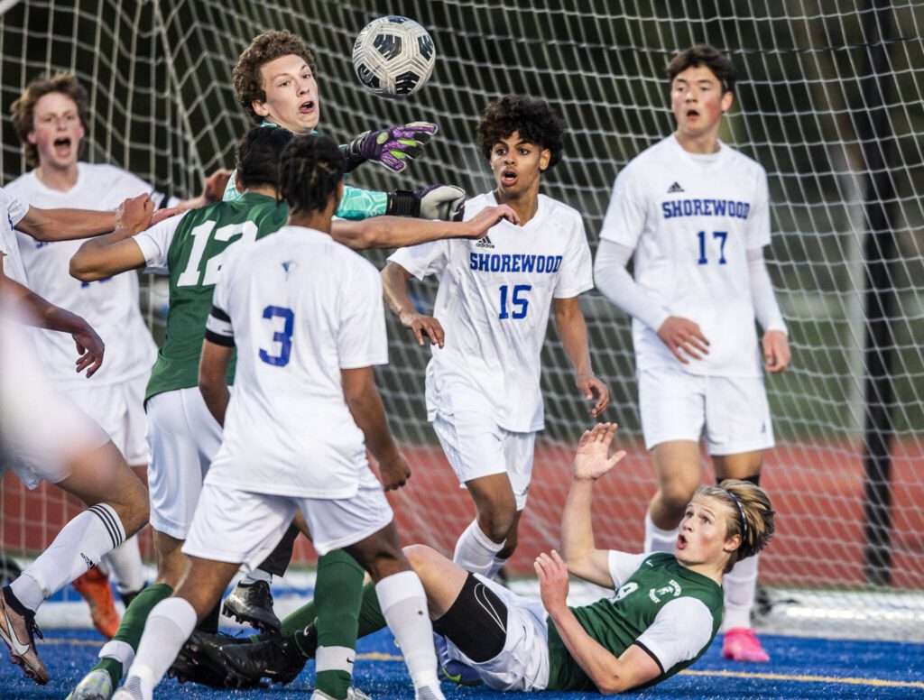 Players watch as the ball is headed in the goal by Edmonds-Woodway’s Victor Ibarra during the game on Tuesday, May 9, 2023 in Shoreline, Washington. (Olivia Vanni / The Herald)
