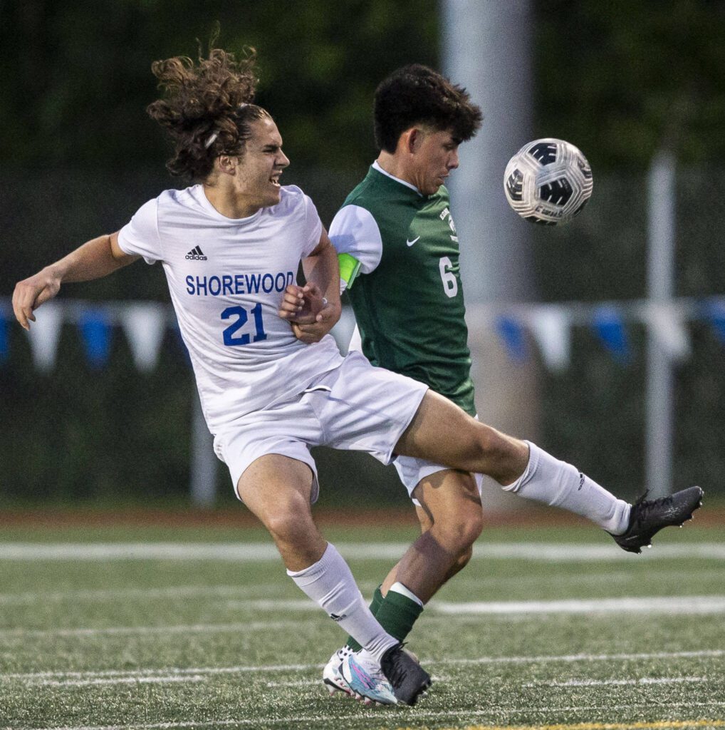 Shorewood’s Atticus Benitz and Edmonds-Woodway’s Edgar Cabrera fight for the ball during the game on Tuesday, May 9, 2023 in Shoreline, Washington. (Olivia Vanni / The Herald)
