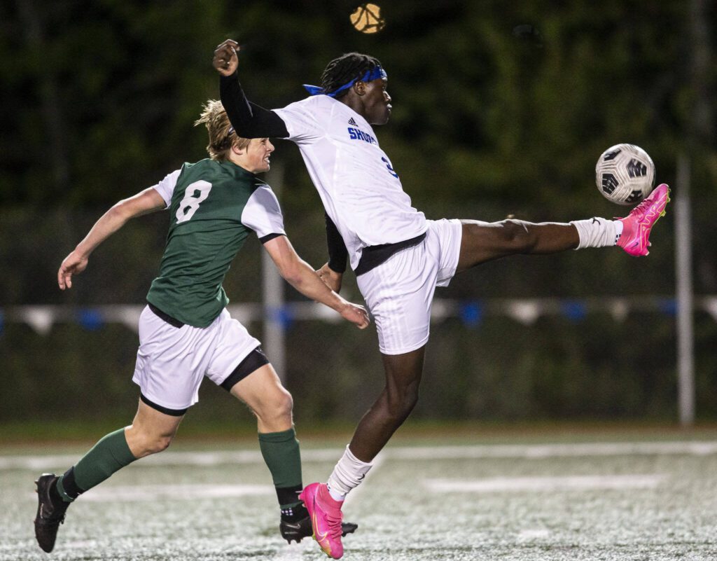 Shorewood’s Anthony Henry reaches out to kick the ball during the game against Edmonds-Woodway on Tuesday, May 9, 2023 in Shoreline, Washington. (Olivia Vanni / The Herald)
