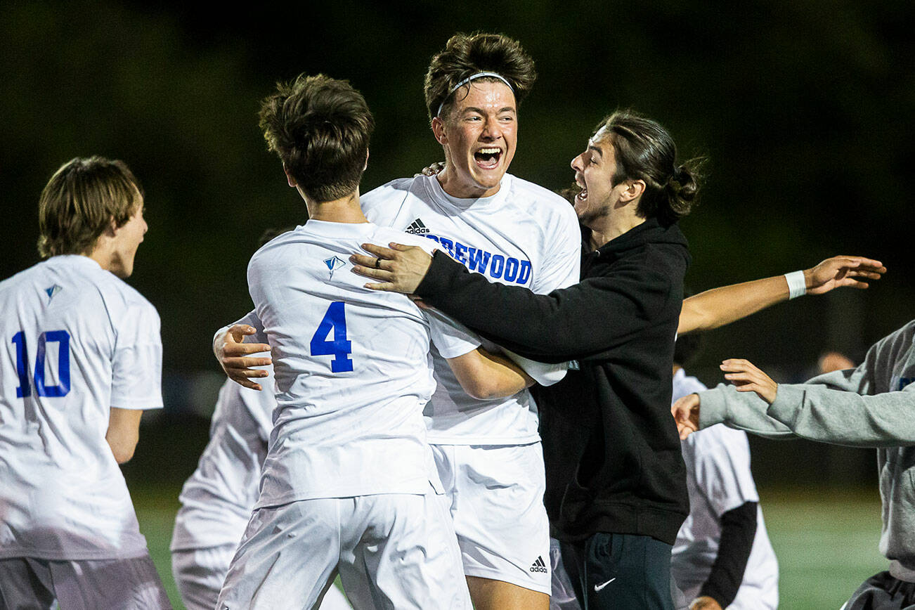 Shorewood players celebrate beating Edmonds-Woodway on Tuesday, May 9, 2023 in Shoreline, Washington. (Olivia Vanni / The Herald)