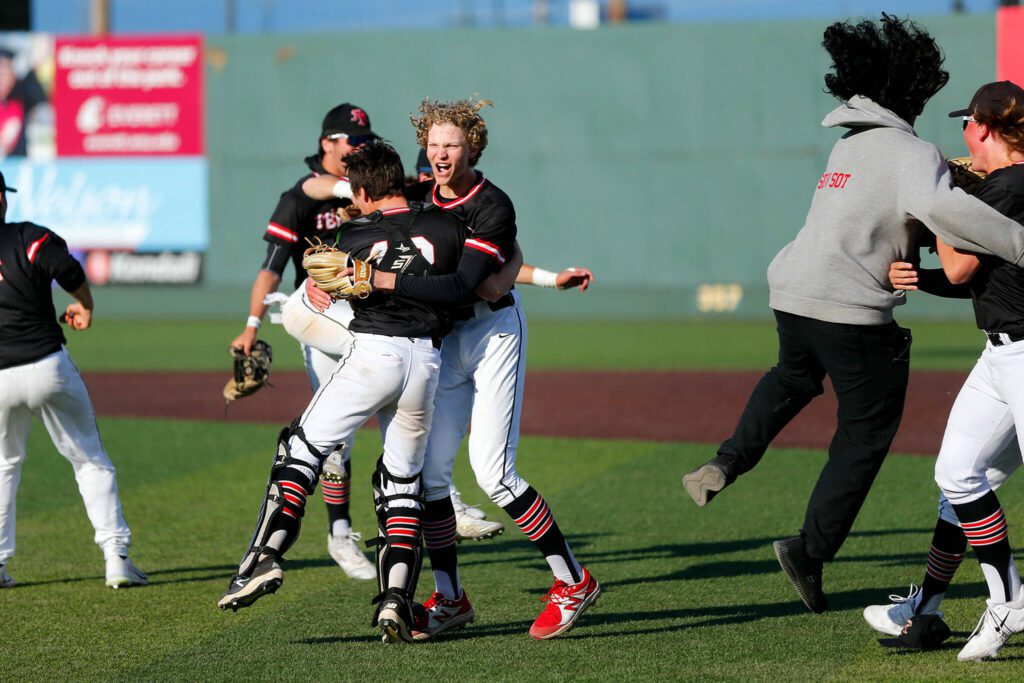 Mountlake Terrace begins celebrating a one-run victory over Shorewood in a Wesco 3A District 1 semifinal on Tuesday, May 9, 2023, at Funko Field in Everett, Washington. (Ryan Berry / The Herald)
