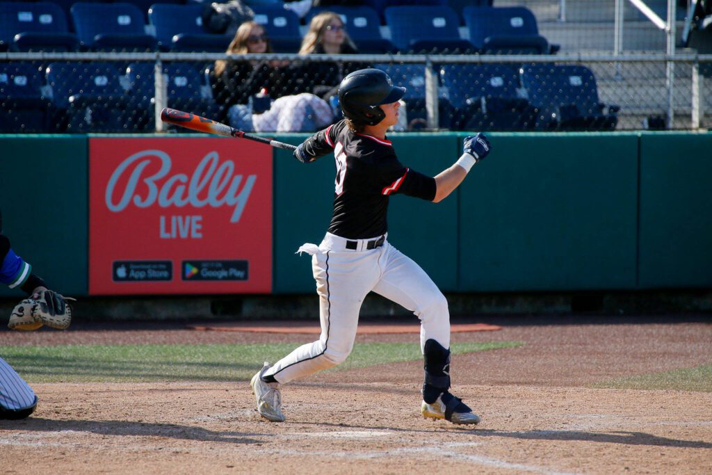 Mountlake Terrace’s Talan Zenk hits a single through the infield against Shorewood in a Wesco 3A District 1 semifinal on Tuesday, May 9, 2023, at Funko Field in Everett, Washington. (Ryan Berry / The Herald)
