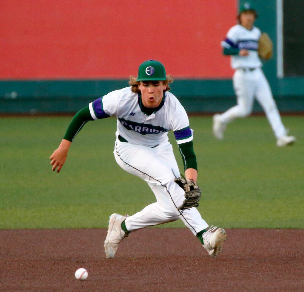 Edmonds-Woodway’s Grant Oliver ranges to his left and throws out a runner on a grounder against Ferndale in a Wesco 3A District 1 semifinal on Tuesday, May 9, 2023, at Funko Field in Everett, Washington. (Ryan Berry / The Herald)
