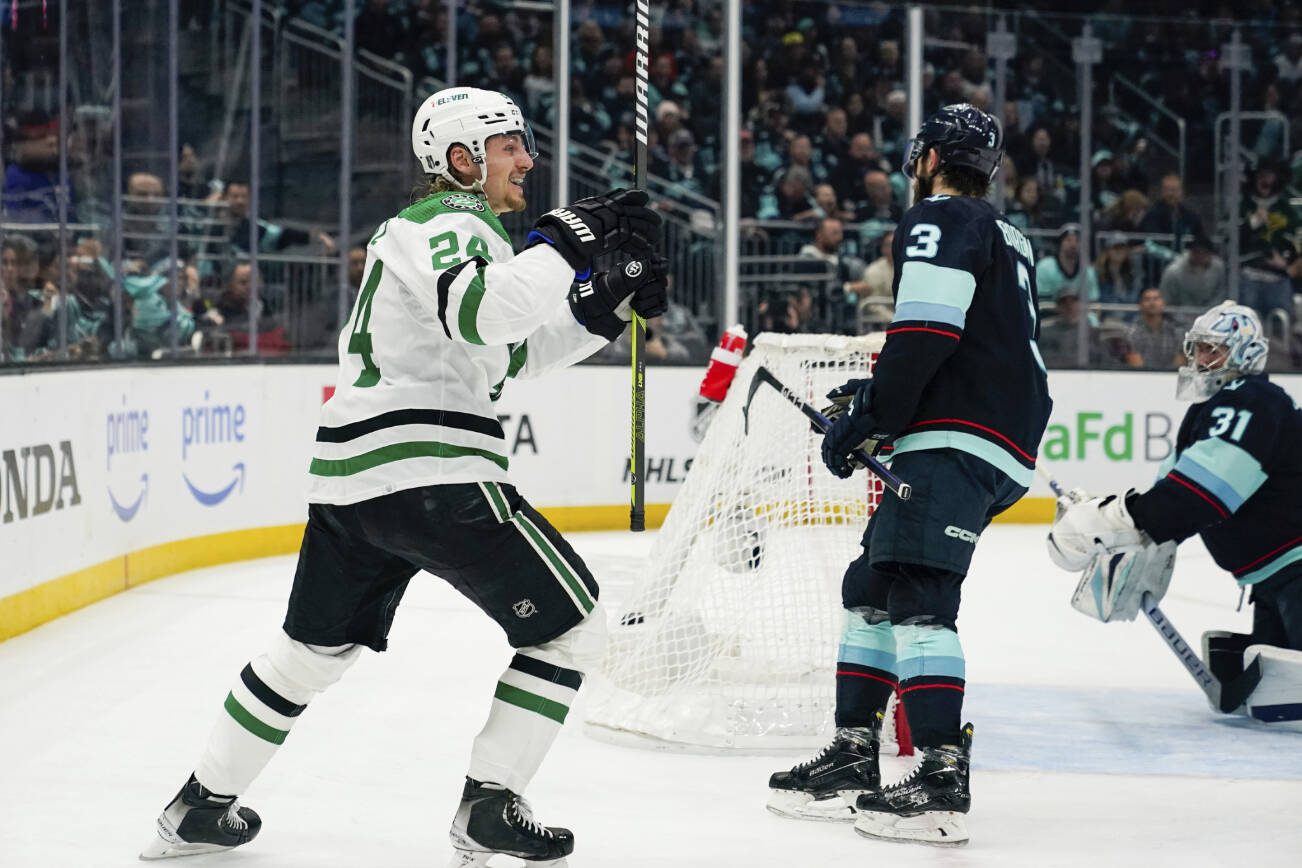 Dallas Stars center Roope Hintz (24) celebrates his goal against Seattle Kraken goaltender Philipp Grubauer (31) during the second period of Game 4 of an NHL hockey Stanley Cup second-round playoff series Tuesday, May 9, 2023, in Seattle. (AP Photo/Lindsey Wasson)