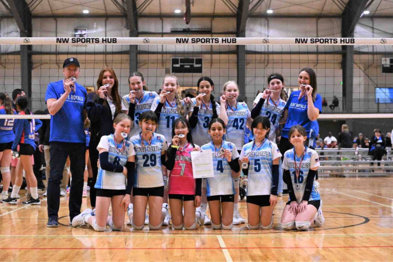 The Mukilteo-based Blue Royals Volleyball Academy’s under-12 team receives their bid letter to nationals and medals after finishing second at the USA Volleyball Puget Sound Regional Championships on April 29-30 in Centralia. (Provided photo)