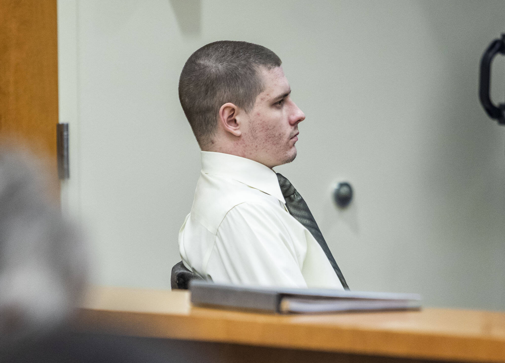 Shayne Baker listens to Carrie Jenks’ testimony during his trial at the Snohomish County Courthouse on Tuesday, May 2, 2023 in Everett, Washington. (Olivia Vanni / The Herald)